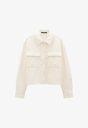 Cream corduroy cropped jacket with a classic collar, button closure, and two front pockets featuring a ribbed texture. Soft fabric finish.