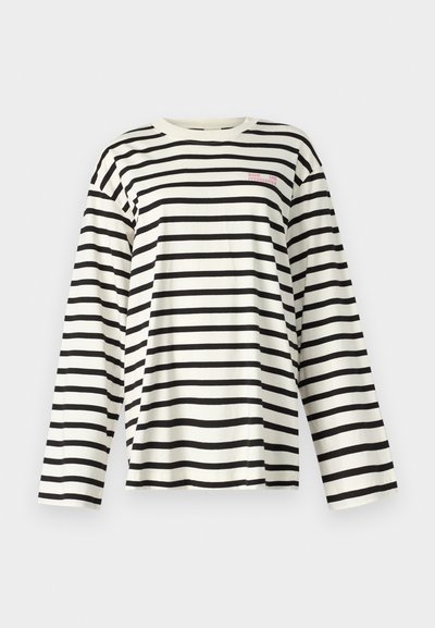 T-shirt de mangas compridas com riscas horizontais pretas e brancas, decote redondo, em tecido de algodão, com pequeno texto bordado no peito.