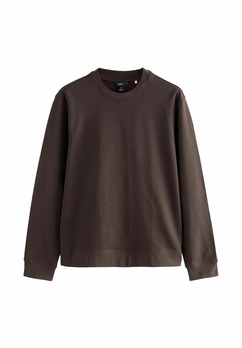 Pruun sweatshirts pehmest kangast, ümar kaelus, pikad varrukad ning lõtv istuvus ribidega mansettide ja alläärega.