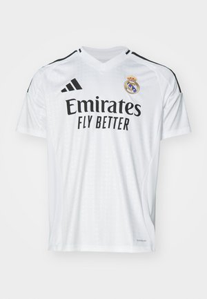 White short-sleeve football shirt with a V-neck, featuring black stripes on shoulders, "Emirates Fly Better" logo, and club emblem.