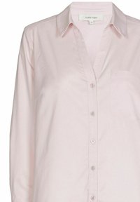Lichtroze overhemd met lange mouwen, knoopsluiting en kraag, voorzien van een borstzak, gemarkeerd als Marie Méro, maat 38.