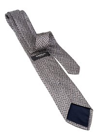 Kootud lips halli, musta ja valgega geomeetrilise mustriga. Sisepind on tumesinine ning sellel on silt tekstiga "SANGAR."