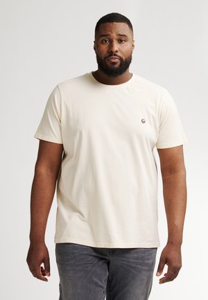 T-shirt a maniche corte color crema con scollatura rotonda e piccolo logo ricamato sul lato sinistro del petto. Materiale in cotone morbido, vestibilità comoda.