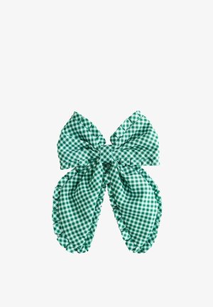 Green and white gingham fabric bow with ruffled edges and large, rounded tails on a white background.