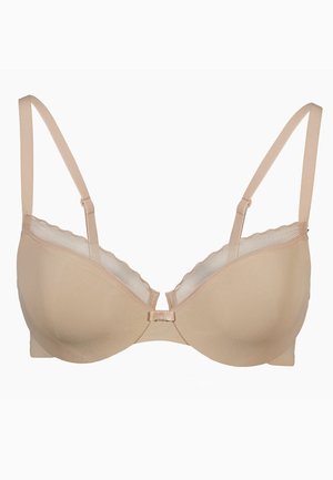Reggiseno beige chiaro in tessuto morbido, con spalline regolabili e bordo in pizzo ondulato lungo il margine superiore. Design con ferretto e chiusura frontale.