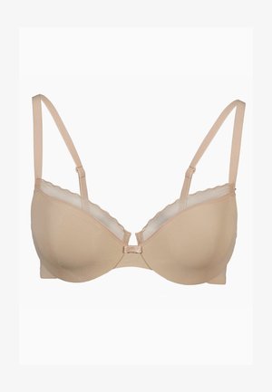 Reggiseno beige chiaro in tessuto morbido, con spalline regolabili e bordo in pizzo ondulato lungo il margine superiore. Design con ferretto e chiusura frontale.