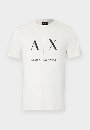 T-shirt blanc en coton à manches courtes avec logo noir "A|X" et texte "Armani Exchange" centré sur le devant.