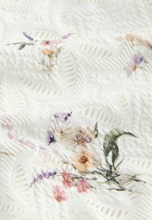 White textured fabric with floral patterns in soft pastel colors. Features raised designs and light embossing, creating depth and interest.