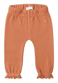 Geribbelde oranje peuterlegging met een elastische tailleband en ruffles aan de enkels. Bevat een klein geborduurd logo nabij de tailleband.
