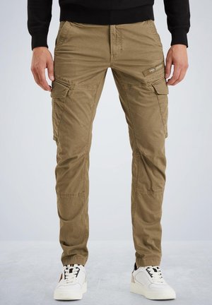 Khaki cargo pants in a textured fabric, featuring multiple pockets and tapered cuffs, paired with white sneakers and a black top.