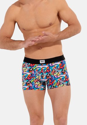 Bunt gemusterte Boxershorts mit geometrischen Formen in Rot, Blau, Grün und Gelb, mit einem schwarzen elastischen Bund und einem Logoetikett.