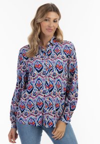 Camicia button-up realizzata in tessuto leggero con un motivo astratto multicolore che presenta tonalità di rosso, blu e viola; maniche lunghe.