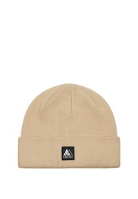 Beige knitted beanie hat with a folded cuff. Features a rectangular black label with a white mountain logo on the front. Soft texture.