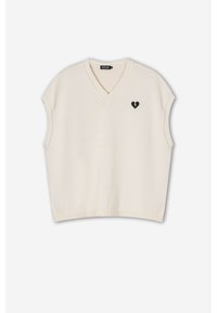 Cremfarbener gestrickter ärmelloser Pullover mit V-Ausschnitt und geripptem Saum. Verfügt über ein kleines schwarzes gebrochenes Herz-Logo auf der Brust. Weiche Textur.