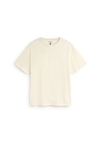 Effen crèmekleurig T-shirt met korte mouwen en ronde hals, plat gelegd op een witte achtergrond, zonder zichtbare patronen of logo's.