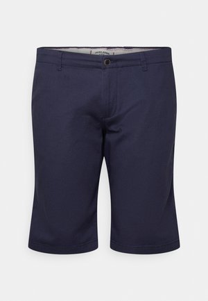 Shorts pour hommes bleu marine, coupe ajustée, longueur au genou, avec fermeture à boutons et passants pour ceinture, présentés de face sur fond blanc.