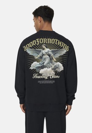 Black sweatshirt featuring a graphic print of an angel with wings, "GOODFORNOTHING" text, and cloud accents, made from soft fabric.