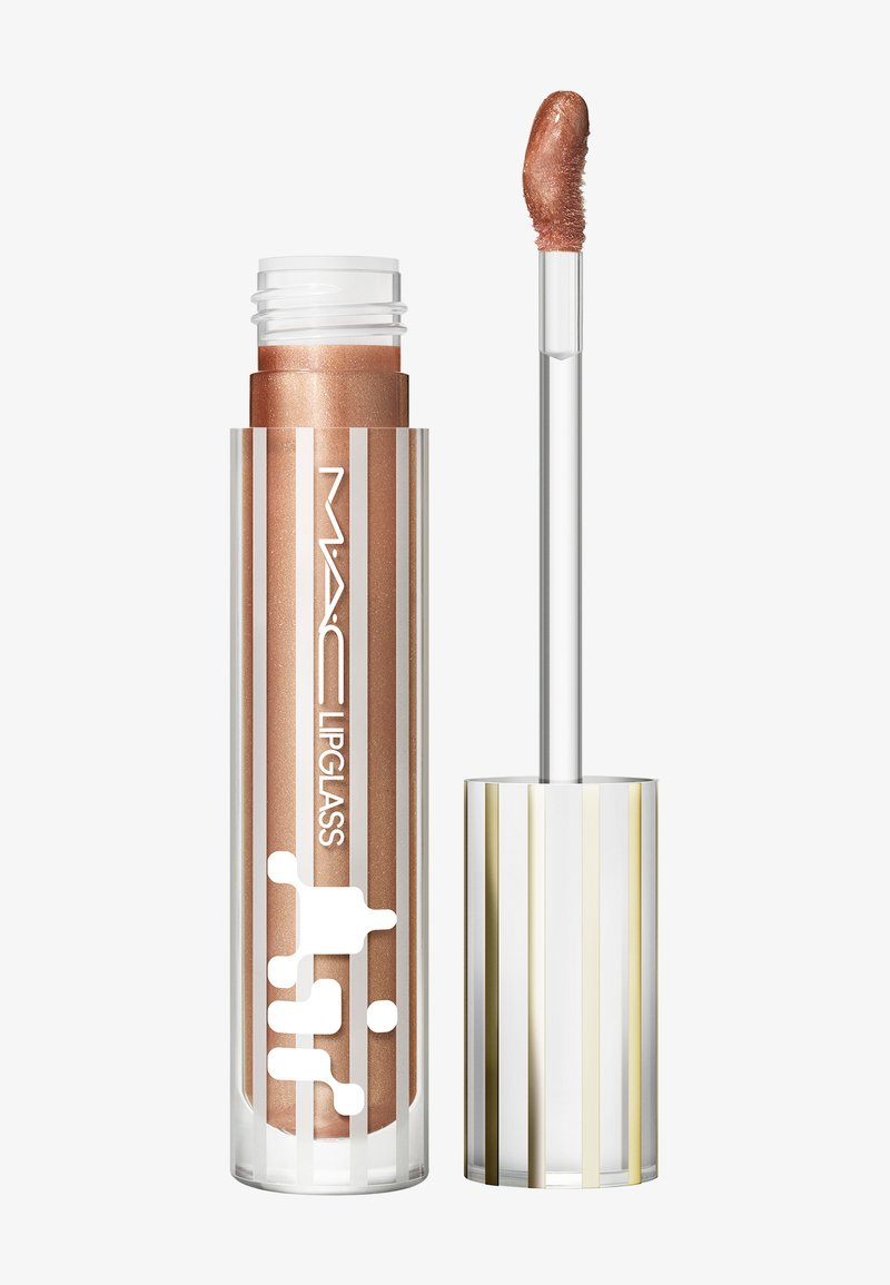 Gomme à lèvres avec une couleur bronze brillante dans un boîtier transparent avec des rayures verticales dorées et blanches. Comprend un applicateur transparent.