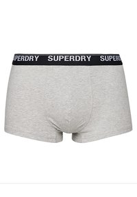 Boxers grises con una cinturilla negra que lleva el nombre de la marca "SUPERDRY". Material de algodón suave, diseño ajustado y textura lisa.
