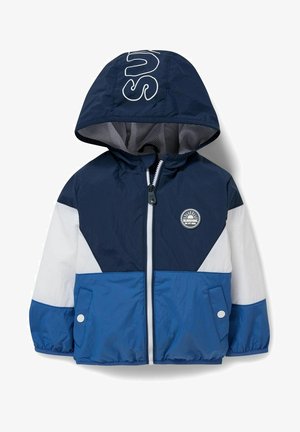 Navy, blue, and white windbreaker jacket featuring a hood, zip closure, mesh lining, and a circular logo accent on the chest.
