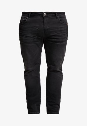 Zwarte denim jeans met een slim fit, vijf zakken, knoop- en ritsluiting, en subtiele textuurdetails. Versterkte stiksels langs de naden.