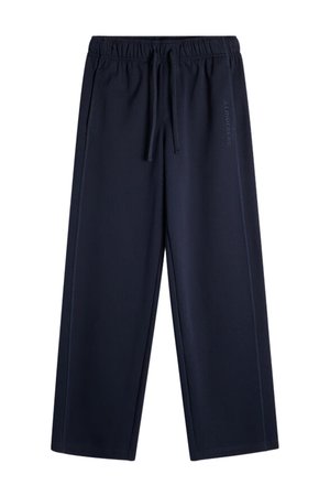 Marineblaue Freizeithose mit elastischem Bund und Kordelzug, geradem Bein, mit dezenten vertikalen Seitennähten und schwachem Markenlogo am rechten Oberschenkel.