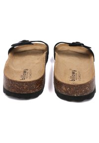 Des tongs noires avec des semelles en liège, surface texturée et semelle en caoutchouc. Elles présentent un design simple et une sangle réglable.