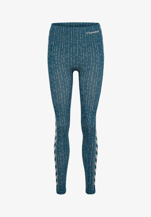 Blå leggings med vitt vertikalt linjemönster, elastisk midja och märkeslogotyp. Tillverkade av elastiskt tyg, skräddarsydda för en åtsittande look.