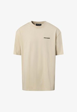 Beige cotton t-shirt with a round neckline and short sleeves. Features a small black "PEGADOR" logo on the front. Simple, clean design.