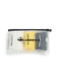 Set od tri čarape u prozirnoj torbici sa zatvaračem. Sadrži bijele, žute i crne čarape, svaka s logotipom "KARL LAGERFELD".
