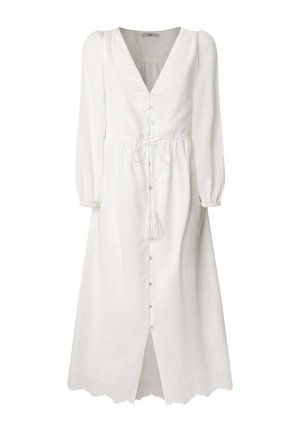 Robe blanche à manches longues avec un décolleté en V, un devant à boutons, une taille cintrée et un ourlet festonné. Présente un motif œillet décoratif et un gland.