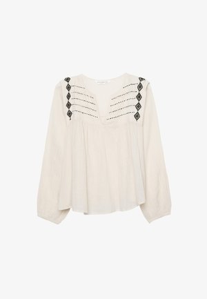 Light beige blouse with long sleeves, V-neck, and black embroidered detail. Features pleats at the shoulders and a loose, flowy fit.