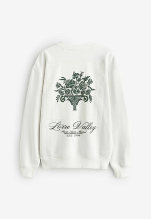 Witte sweatshirt met een groen bloemenprintdesign op de achterkant, met de tekst "Loire Valley" en het oprichtingsjaar eronder gedrukt.