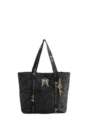 Black quilted tote bag with long branded handles, front logo patch, and gold-tone Baker keychain charm.
