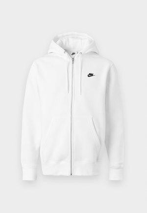 Valkoinen vetoketjullinen huppari, valmistettu pehmeästä puuvillasekoitteesta. Varustettu mustalla Nike-logolla, etutaskuilla ja säädettävällä kiristysnauhalla hupussa. Sileä pinta.