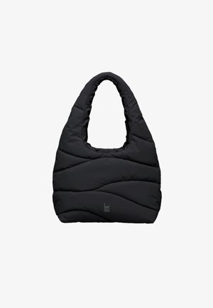 Sac fourre-tout matelassé noir avec poignées arrondies et surpiqûres ondulées subtiles, avec un petit logo "GOT BAG" en bas au centre.