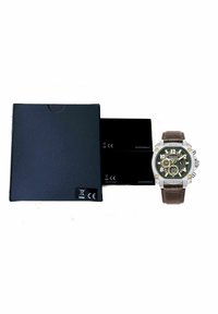 Brown leather strap watch with a silver stainless-steel case, black and gold face, and three sub-dials. Accompanied by a black box and cards.