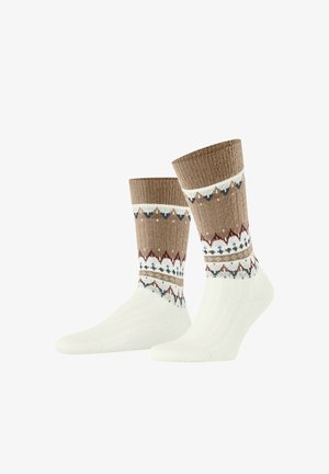 Chaussettes tricotées en blanc et marron avec un bord à motifs comprenant des accents rouges, bleus et blancs. Texture douce avec un design côtelé.