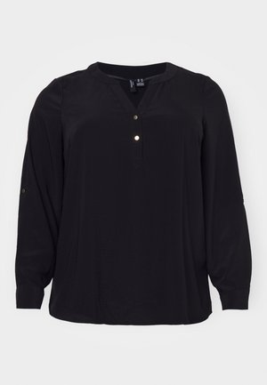 Fekete blúz könnyű anyagból, V-kivágással és három arany gombbal. Hosszú ujjak, gombos díszítéssel a mandzsettán.