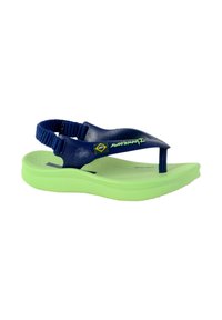Navy blue rubber sandal with green sole, adjustable fabric strap, and minimalist design featuring a small logo and Brazilian flag emblem.