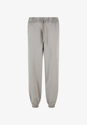 Lichtgrijze joggers van zachte stof, met een elastische tailleband met trekkoord en elastische boorden bij de enkels.