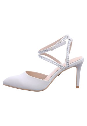 White high-heeled shoe with a pointed toe and shiny crystal-accented ankle strap. Smooth material and beige interior, sleek silhouette.