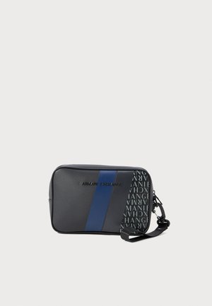 Compact black and blue Armani Exchange pouch with diagonal stripes, logo text, and detachable wrist strap on a white background.