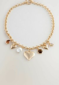 Gold chain necklace featuring six pendants: three hearts, a teardrop, a hexagon, and a round charm in various materials and finishes.