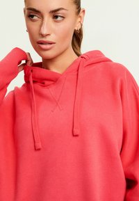 Next Huppari - fluro pink