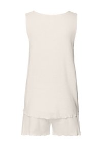 Top senape senza maniche abbinato a pantaloni corti coordinati, caratterizzato da un tessuto morbido e un dettaglio a zig-zag sul bordo. Design minimalista e texture liscia.