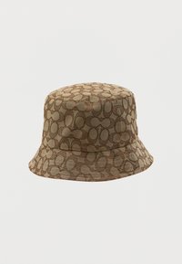 Brown bucket hat made of textured fabric, featuring an all-over circular pattern in darker shades. Brim is wide and relaxed in shape.