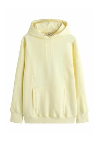 Gele hoodie gemaakt van zacht materiaal met een voorzak, capuchon met trekkoord en een losse pasvorm. Voorzien van geribbelde boorden bij de mouwen en zoom.