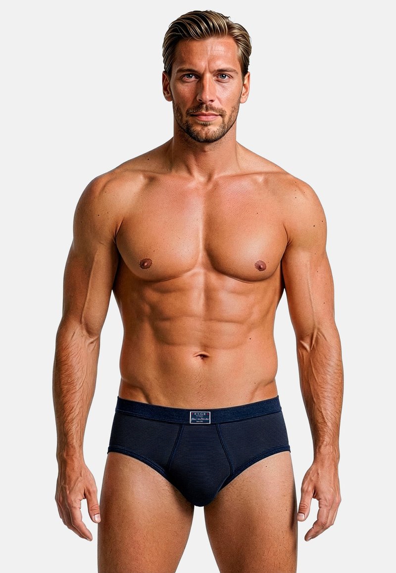 Slip da uomo blu navy con texture a coste e design aderente. Presentano una vita con logo e uno stile minimalista.