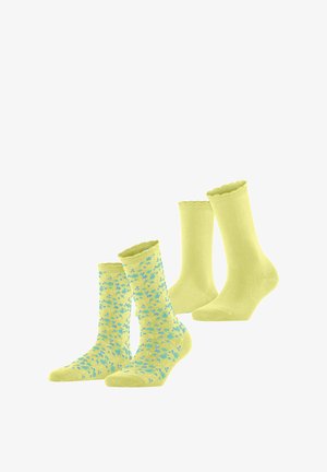 Due paia di calzini gialli, uno di colore uniforme e uno con un motivo floreale blu, entrambi con polsini smerlati.